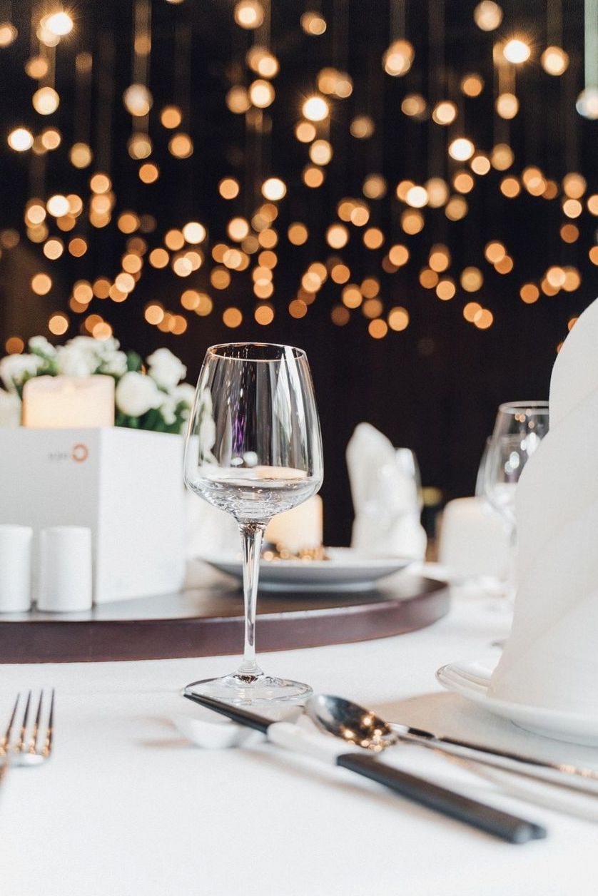 Set dining table with warm bokeh lighting
