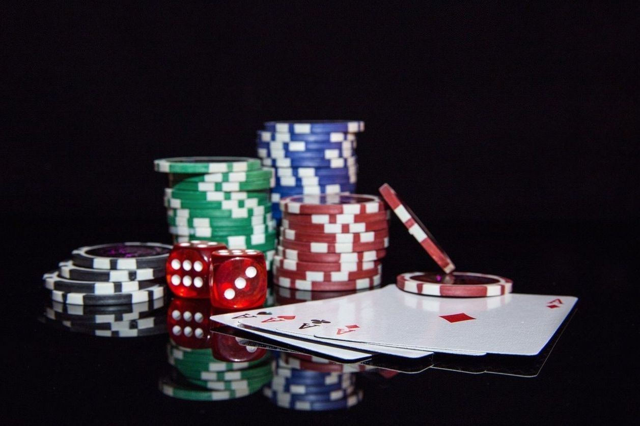 Cards, chips and dice staged for a game evening