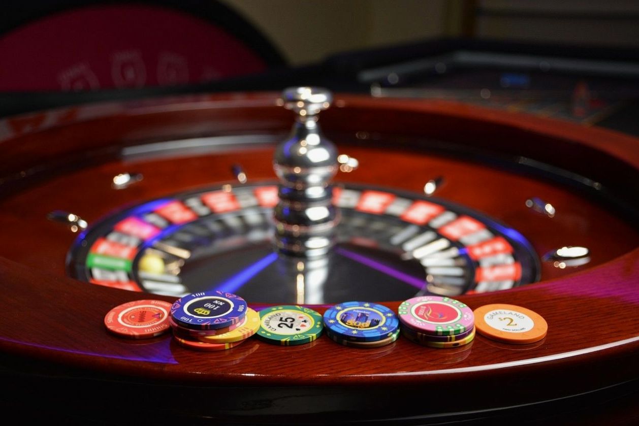 Roulette wheel with chips under warm light